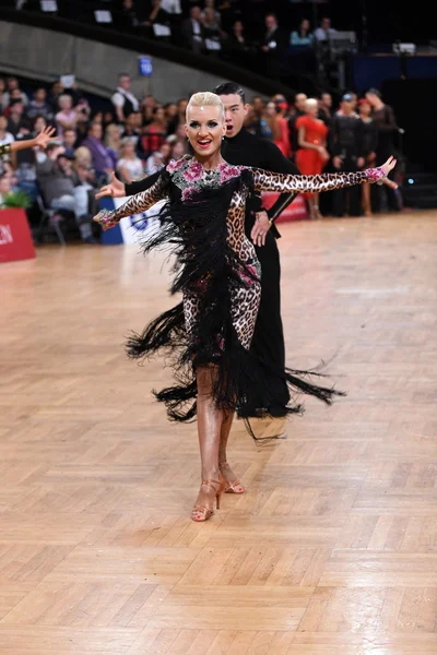 Female latin dancer dancing during competition — Stock Photo, Image
