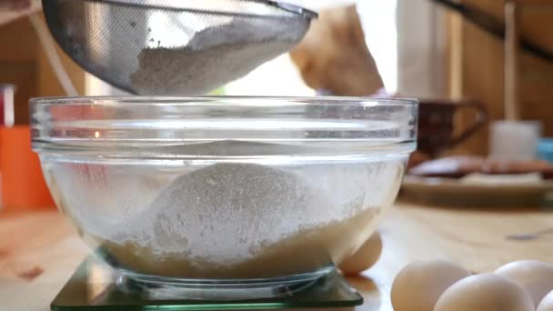 Someone bolting the flour through a sieve — Stock Video