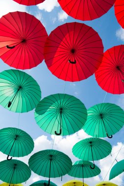 Bright colorful red and green umbrellas background