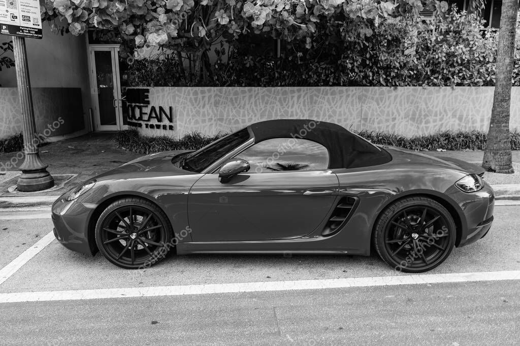 Miami Beach, Florida USA - June 9, 2024: 2018 Porsche 718 Boxter s orange color at miami beach. luxury car porshche at ocean drive Miami beach. side view