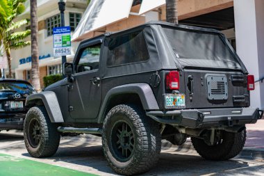 Miami, Florida, USA - April 13, 2025: Pickup truck car Jeep Wrangler. Car Jeep Wrangler parked outdoor. Grey pickup truck, corner view. Jeep Wrangler car with glowing grey shimmer glitter tuning.