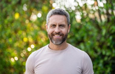 Portrait mature male model has smiling happy face. Hispanic man model has style. Happy man. Fashion model. Casual style. Hispanic man portrait outdoor. Mature man casual style.