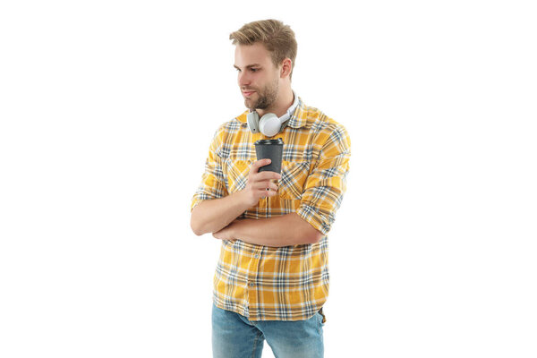 Lifestyle concept. Drinking espresso. Man drinking tea with headphones. Warm morning. Coffee break at home. Millennial man having coffee cup isolated on white. Morning coffee time.