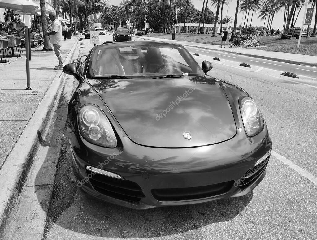 Miami Beach, Florida USA - June 8, 2024: 2018 Porsche 718 Boxter blue color at miami beach. luxury car porshche at ocean drive Miami beach. front view