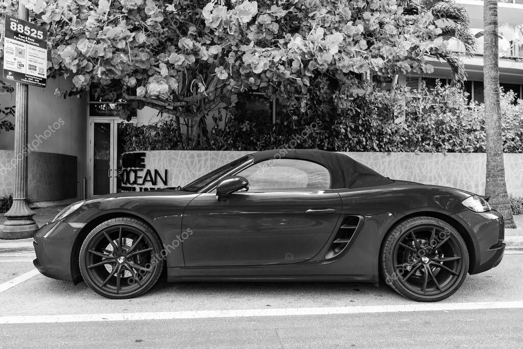 Miami Beach, Florida USA - June 9, 2024: 2018 Porsche 718 Boxter s orange color at miami beach. luxury car porshche at ocean drive Miami beach. side view