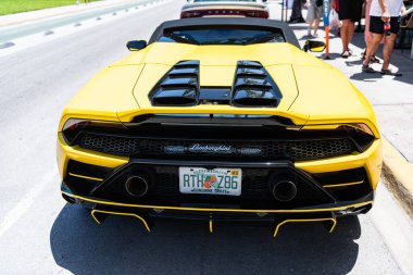 Miami, Florida, USA - July 26, 2025: Lamborghini Huracan EVO sport car convertible. Luxury yellow car Lamborghini Huracan EVO. Car of Lamborghini Huracan EVO parked outdoor. Lamborghini, back view.