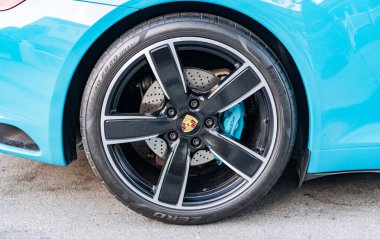 Miami, Florida, USA - February 16, 2025: Blue car, wheelview. 2017 Porsche 911 Carrera S sport car. Luxury car Porsche 911 Carrera S. Car Porsche 911 Carrera S parked outdoor.