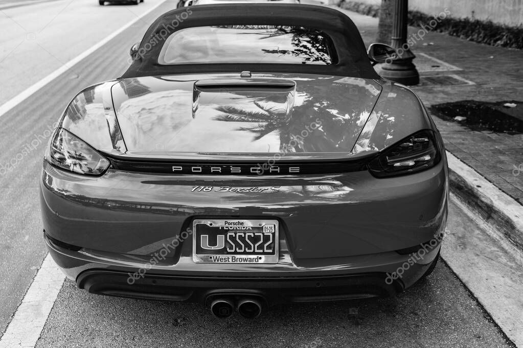Miami Beach, Florida USA - June 9, 2024: 2018 Porsche 718 Boxter s orange color at miami beach. luxury car porsche at ocean drive Miami beach. back view