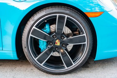 Miami, Florida, USA - February 16, 2025: Blue car, wheelview. 2017 Porsche 911 Carrera S sport car. Luxury car Porsche 911 Carrera S. Car Porsche 911 Carrera S parked outdoor.