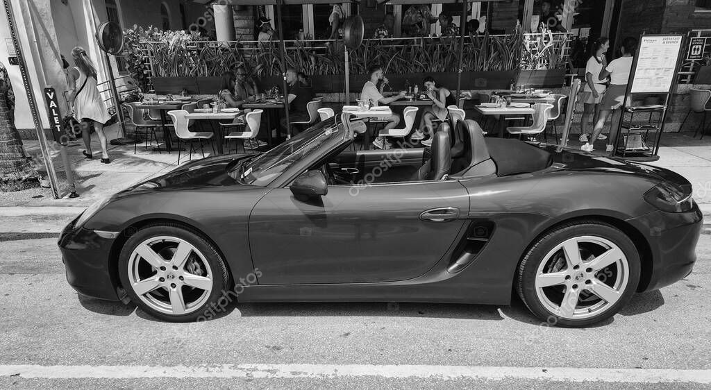 Miami Beach, Florida USA - June 8, 2024: 2018 Porsche 718 Boxter blue color at miami beach. luxury car porshche at ocean drive Miami beach. side view