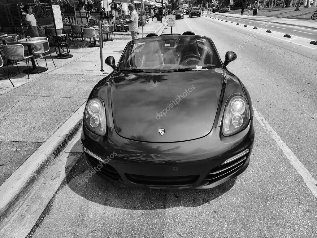 Miami Beach, Florida USA - June 8, 2024: 2018 Porsche 718 Boxter blue color at miami beach. luxury car porshche at ocean drive Miami beach. front view