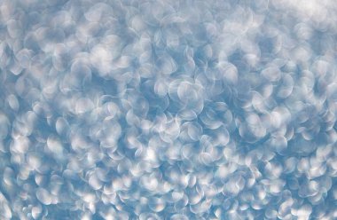 Bokeh 'in pırıl pırıl arka planı. Bulanık odaklı arka plan. Pırıl pırıl bir fon. Parıldayan arka plan. Odaklanamayan ışıltı. Bokeh sahne arkası ışıltısı. Bokeh etkisi. Parıltı parlıyor.