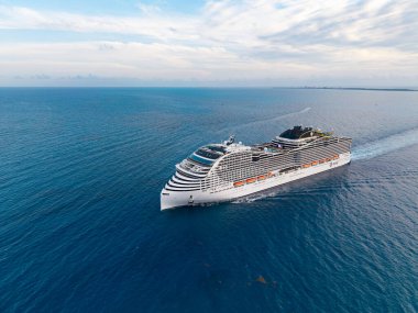 Miami, Florida, USA - May 10, 2025: MSC cruises cruise line. Cruise ship tour and travel at sea. Ship leaving port. MSC World America cruise ship voyage. Cruise in summer vacation. Sea trip.