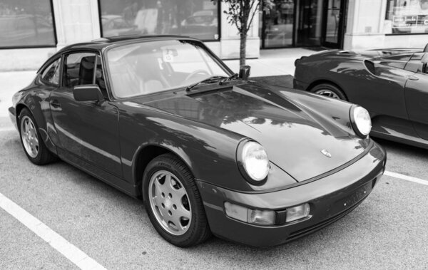 Chicago, Illinois - September 29, 2024: Porsche 911 Carrera Coupe on the road. Porsche 911 Carrera roadster red color. Porsche 911 Carrera speedster in Chicago.