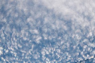 Parıldayan arka plan. Odaklanamayan ışıltı. Bokeh sahne arkası ışıltısı. Bokeh etkisi. Parıltı parlıyor. Bokeh 'in pırıl pırıl arka planı. Bulanık odaklı arka plan. Pırıl pırıl bir fon. Parıltı parıldıyor.