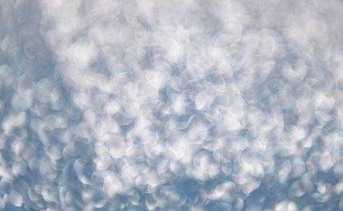 Bokeh sahne arkası ışıltısı. Bokeh etkisi. Parıltı parlıyor. Bokeh 'in pırıl pırıl arka planı. Bulanık odaklı arka plan. Pırıl pırıl bir fon. Parıldayan arka plan. Odaklanamayan ışıltı. Parıltılı konfeti.