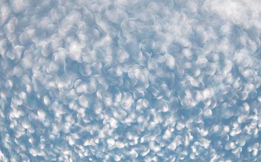 Bokeh sahne arkası ışıltısı. Bokeh etkisi. Parıltı parlıyor. Bokeh 'in pırıl pırıl arka planı. Bulanık odaklı arka plan. Pırıl pırıl bir fon. Parıldayan arka plan. Odaklanamayan ışıltı. Parıltılı konfeti.