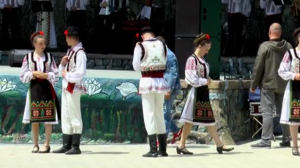 Moldova Cahul 16.05.2021. beautiful guys and girls in national costumes warm up before dancing