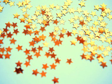 Mavi arka planda altın yıldızlar parıldıyor. Şenlikli bayram, parlak zemin