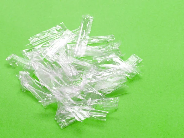 Pile Transparent Plastic Wrapping Rubbish Green Background Top View Many — Stock Photo, Image