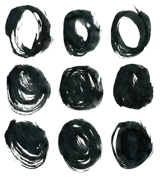Zwarte inkt ronde vormen geïsoleerd op witte achtergrond. — Stockfoto
