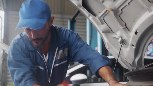 Young Man Mechanic Repairing Engine Car Garage Auto Service Worker — Stock Video