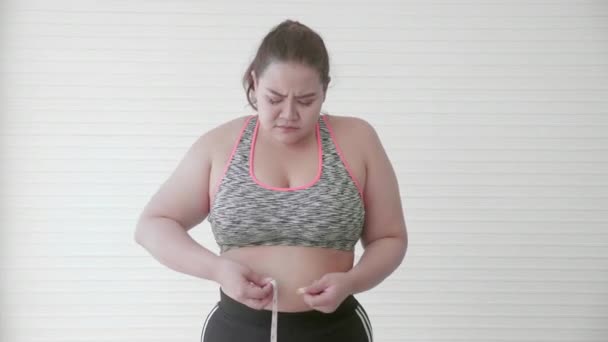 Young Asian Woman Overweight Measuring Waistline Tape Feeling Worried Displeased — Stock Video