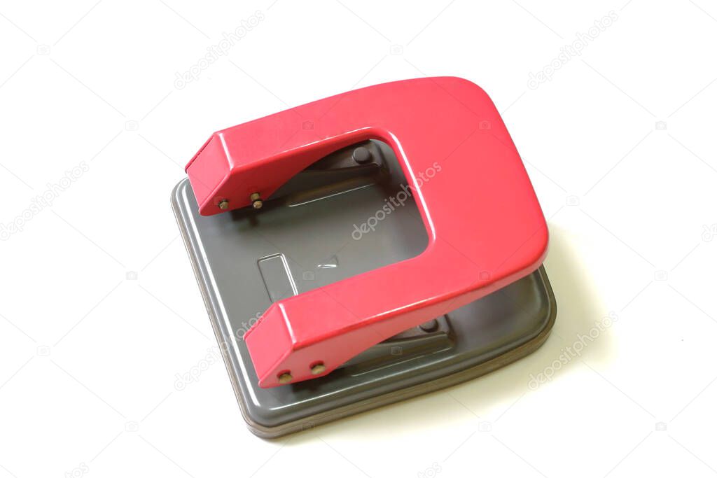 Red paper hole puncher isolated on white background