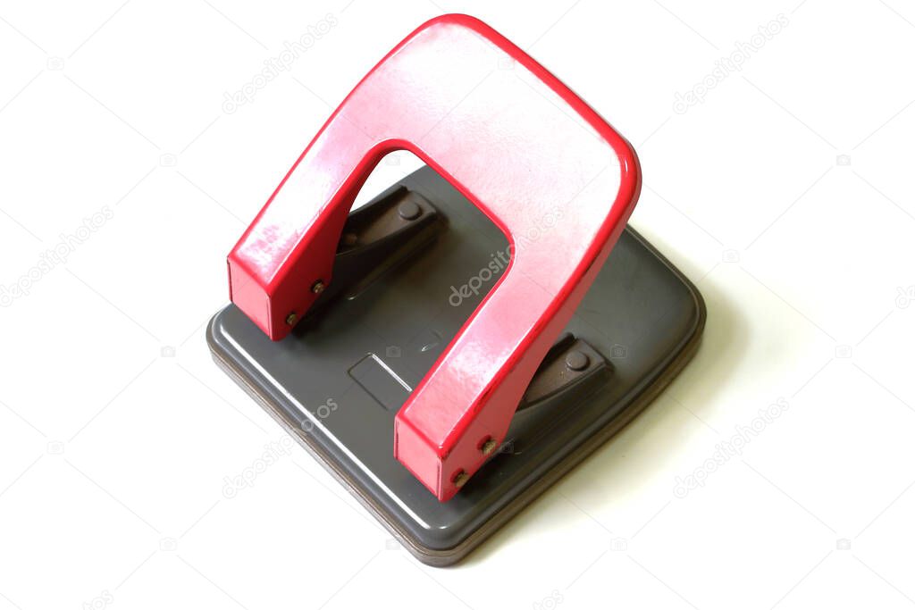 Red paper hole puncher isolated on white background