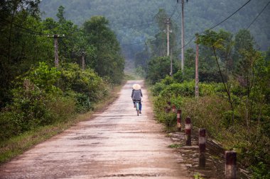 Vietnamese  on the bicycle, Hue, Vietnam