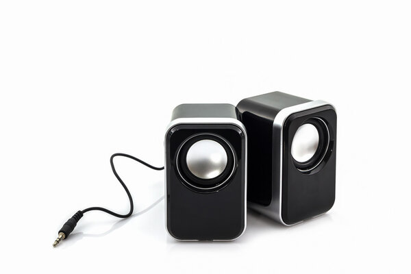 Small computer speakers on white background