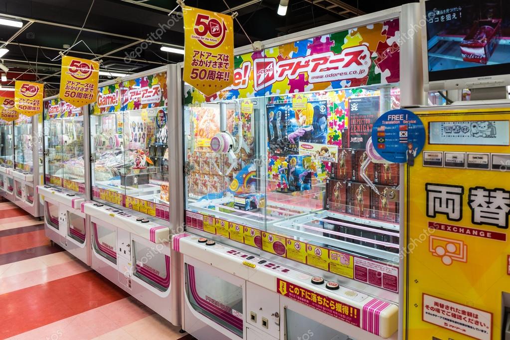 Toy crane game vending machine. Stock Editorial Photo © amnachphoto