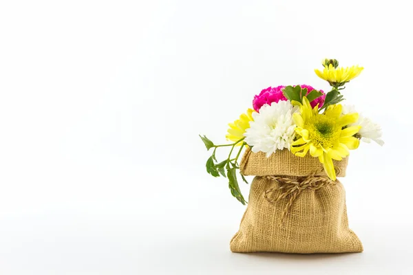 Bouquet fresh flowers in sack . — Stock Photo, Image