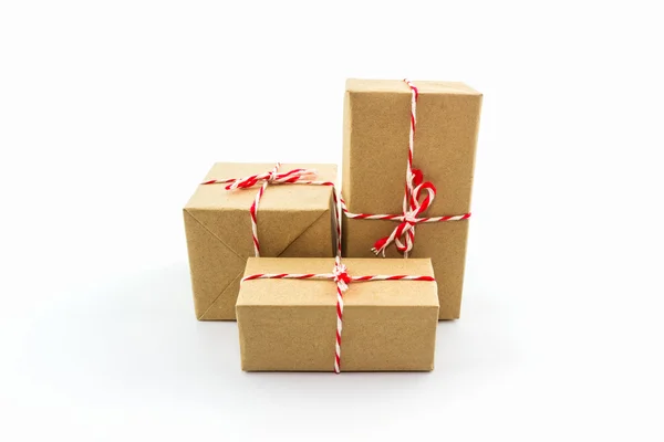 Cardboard carton wrapped with brown paper, tied with string. — Stock Photo, Image