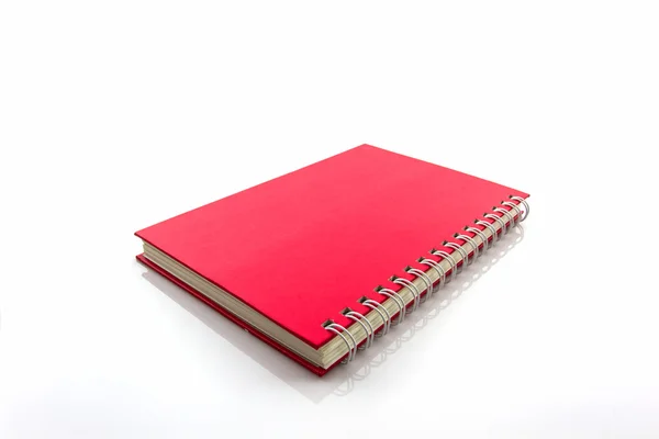 Carnet rouge sur fond blanc . — Photo