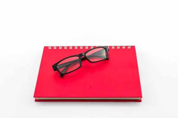 Red Diary Book with old glasses. — Stock Photo, Image