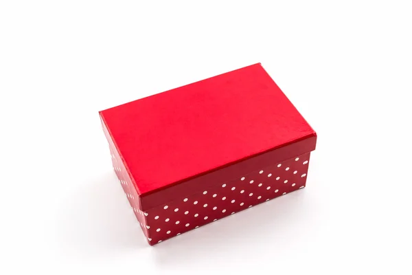 Boîte à pois rouges sur fond blanc . — Photo