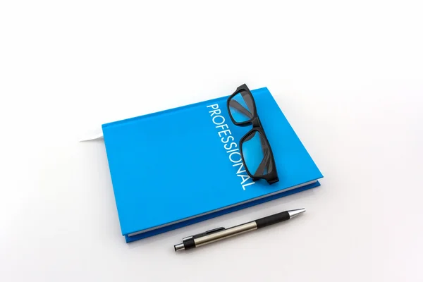 Blauwe dagboek boek met het woord"professional" . — Stockfoto