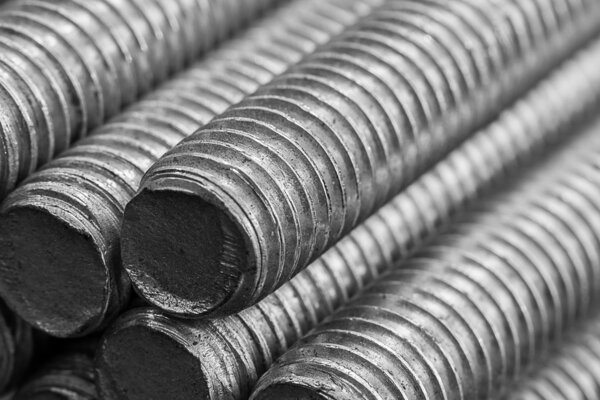 Stack of round steel bar - iron metal rail lines material .