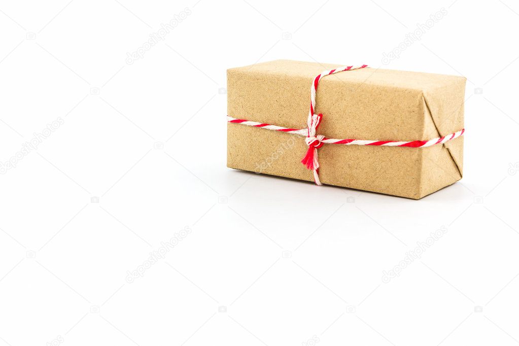 Cardboard carton wrapped with brown paper.