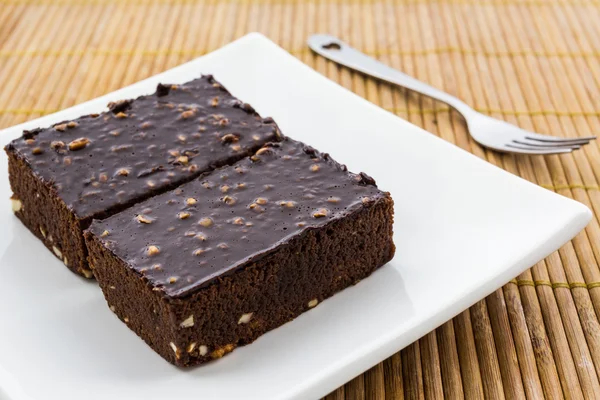 Brownie cake on a white plate. — Stock Photo, Image
