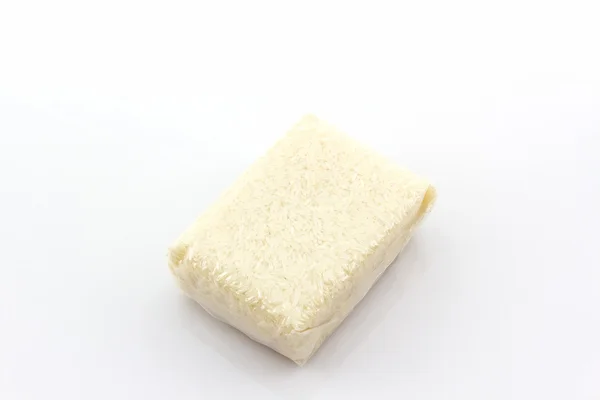 Jasmínová rýže v malém plastovém sáčku. — Stock fotografie
