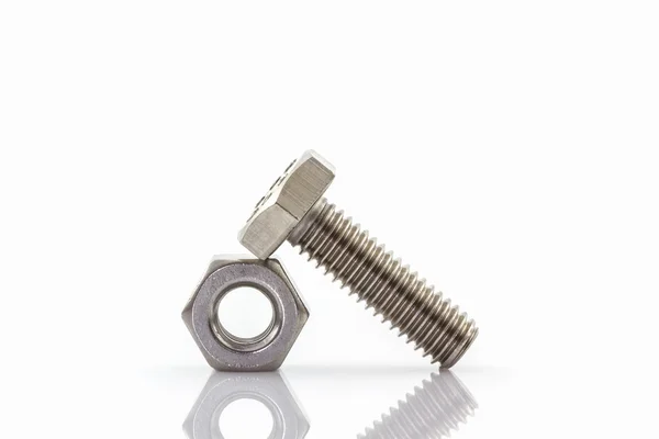 Metal screw and nuts on white background. — Stock Photo, Image