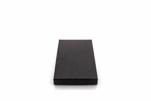 Černá papírová krabička na bílém pozadí . — Stock fotografie