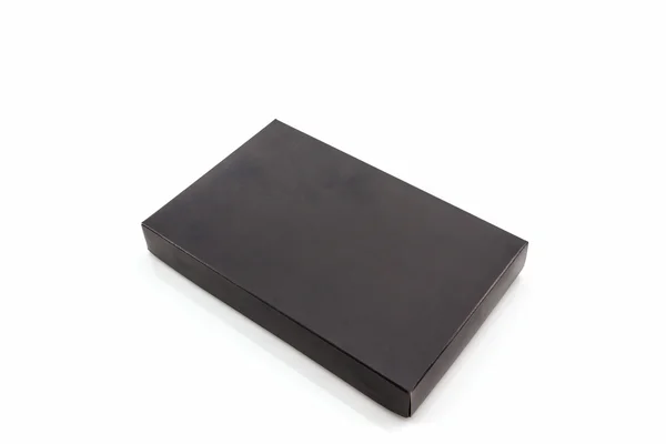 Caja de papel negro sobre fondo blanco . —  Fotos de Stock