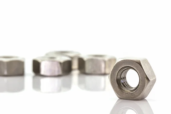 Metal nuts on white background. — Stock Photo, Image