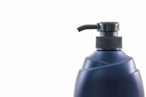 Dark blue bottle on a white background. — Stock Photo, Image