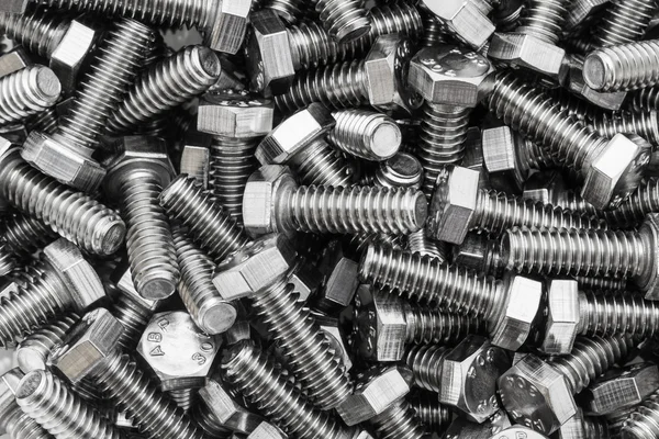 Metal screw and nuts on texture background. — Stock Photo, Image