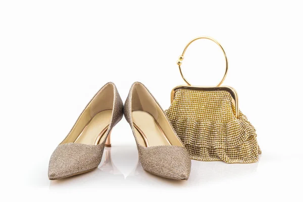 Sammlung goldener Schuhe und Taschen . — Stockfoto