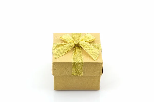 Golden gift box with ribbon bow. — Stock Photo, Image